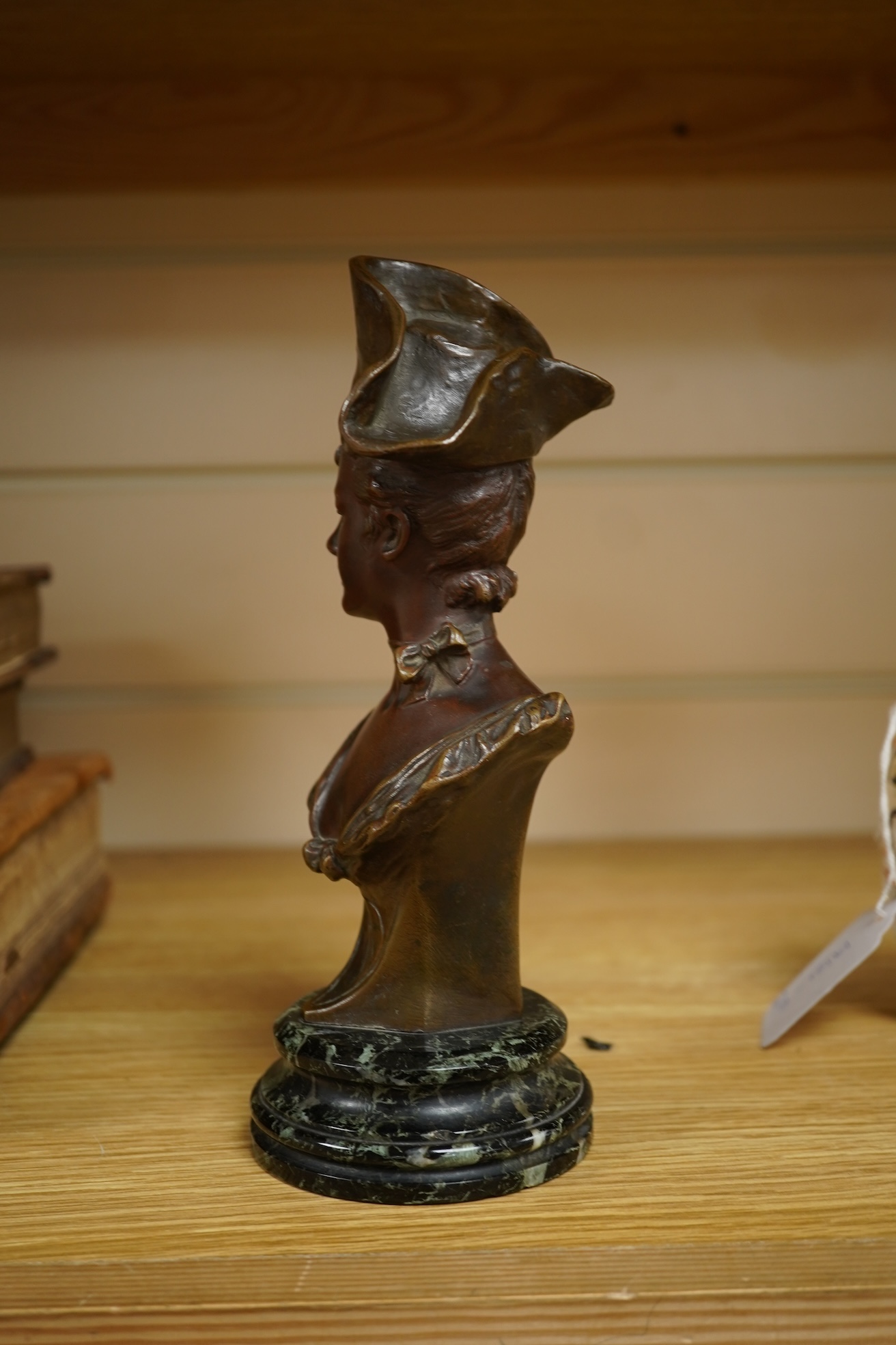 George Van Der Straeten (Belgium, 1856-1928) A bronze bust of a lady wearing a hat, signed, mounted on marble base, 21.5cm high